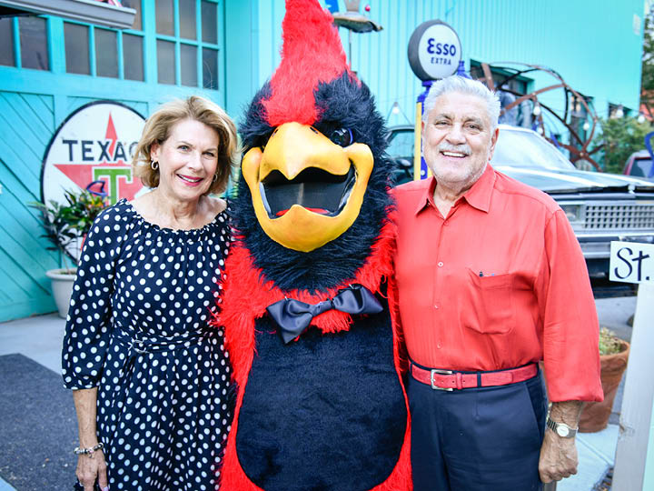 Cardinal with two guests celebrating Fisher