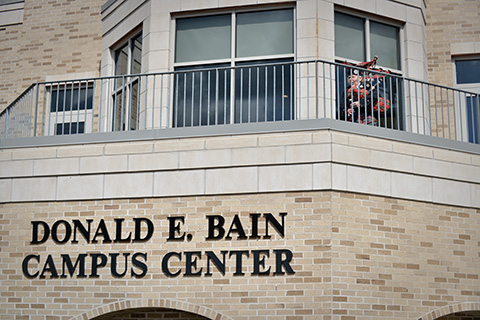 A person playing bagpipes at the dedication of the Donald E. Bain Campus Center.