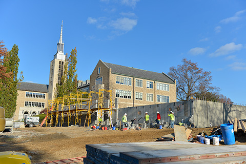 Landscape view of building the foundation for the chapel.