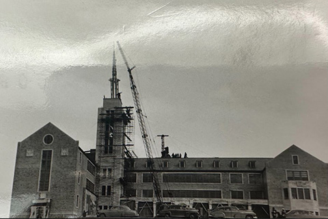 Construction of the steeple on Kearney Hall, St. John Fisher University's original building.