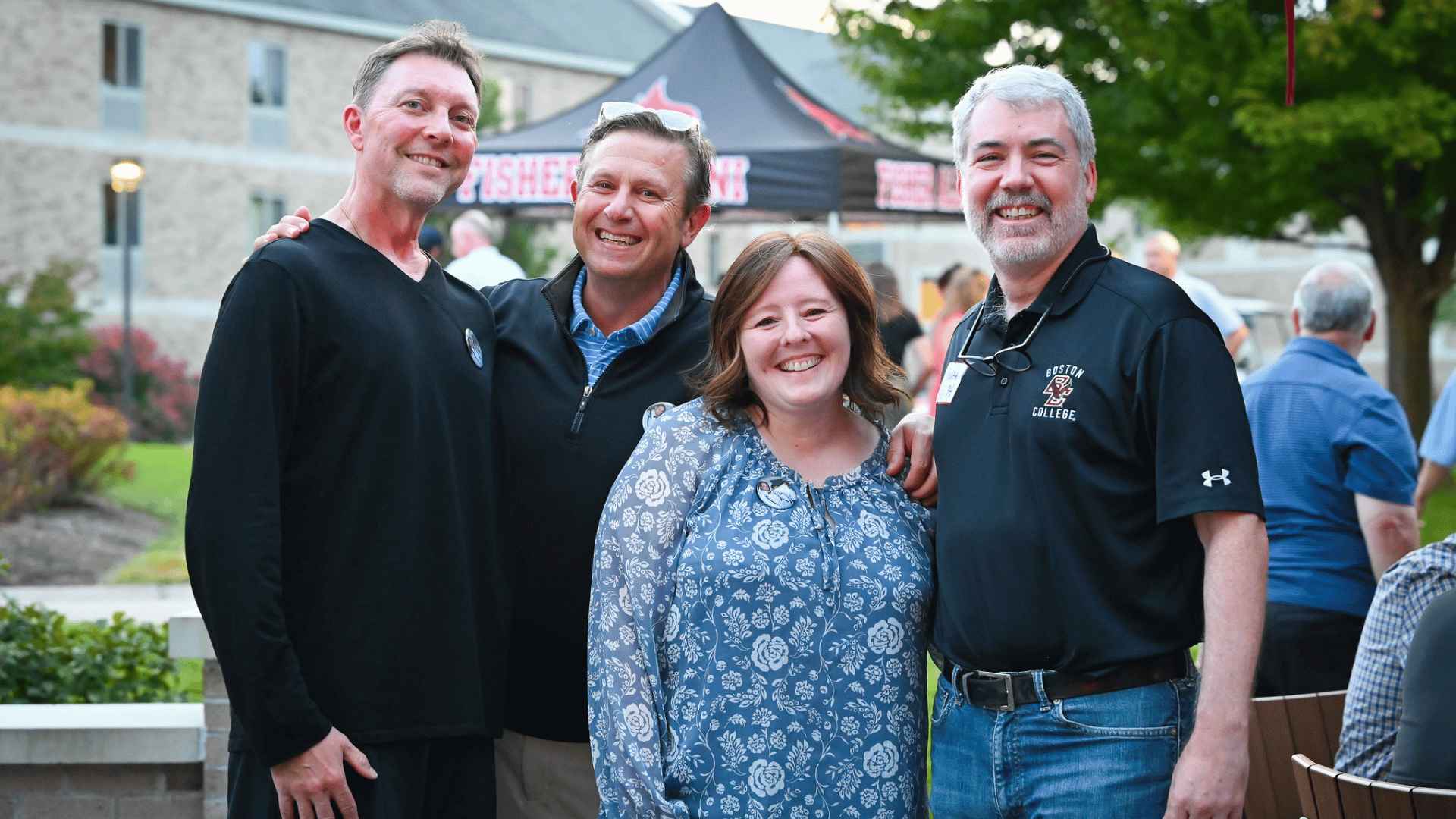 Four alumni gathered at Fisher
