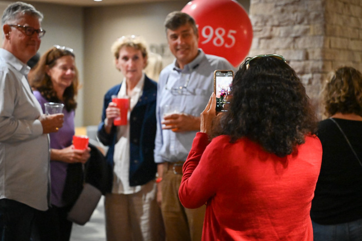 Alumni gathering for a 40th reunion photo