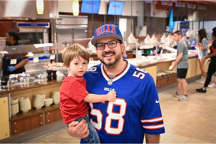 Father and son together at brunch in dining hall
