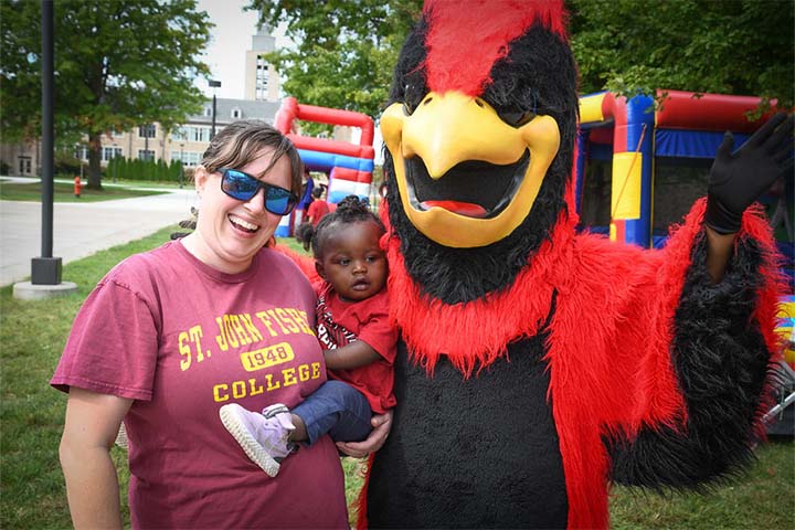 Mother and baby with Beaks the mascot