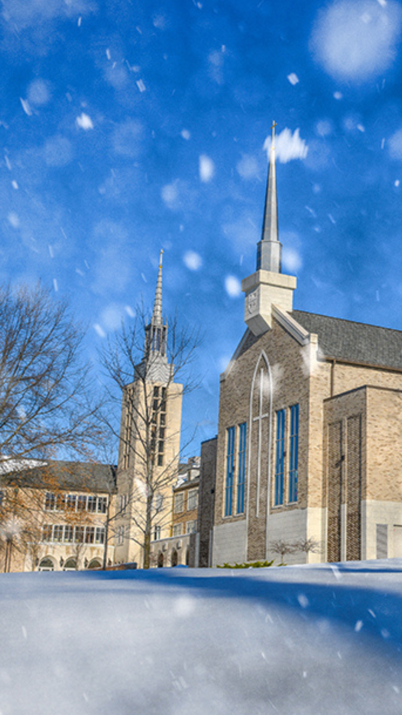 Kearney Hall during snowfall phone wallpaper