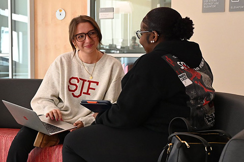 Students sit together in Lavery Library.