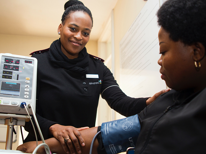 A nurse taking a patient's blood pressure.