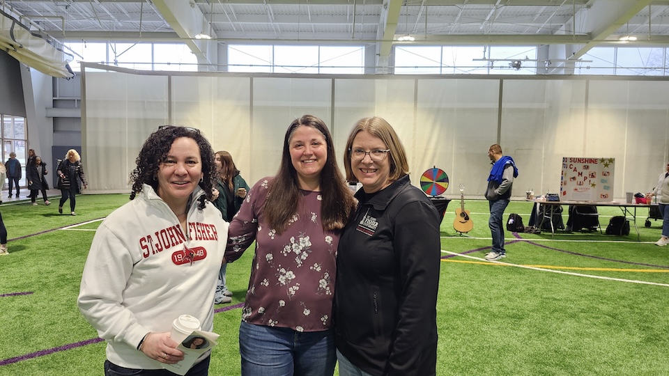 Doctor Holly Brown, Onelee Stevens, and Darcie Mersereau standing shoulder to shoulder