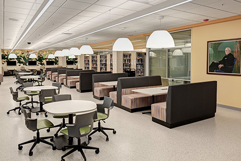 Seating and book collection near the entrance to the Lavery Library Archives.