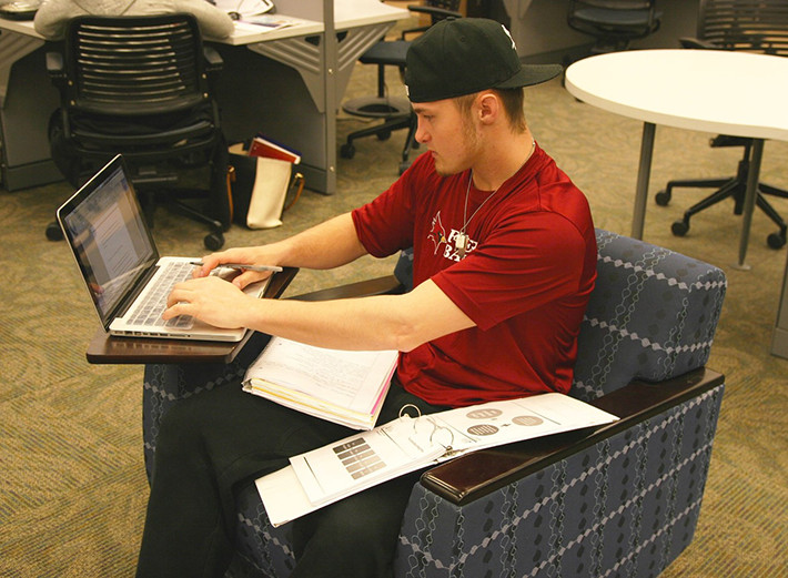 Student working on his laptop at Lavery Library