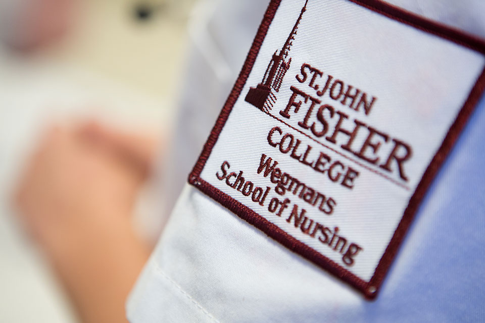 A patch on the uniform students wear at the Wegmans School of Nursing..