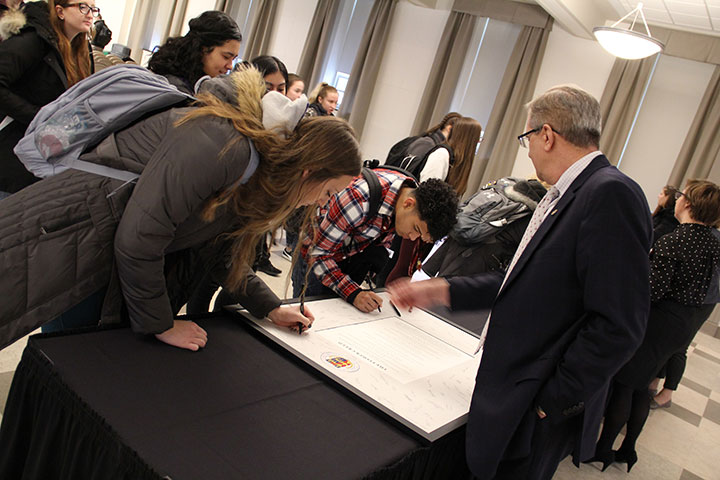 First-year students sign the Fisher Creed.