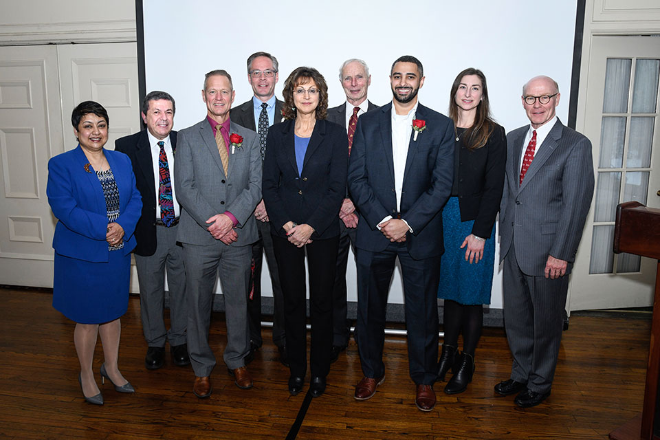 From left to right: Dean Rama Yelkur, Dr. Seyda Deligonul, Ron Sicker, David Pritchard ’83, Cathy D’Amico ’78, Dr. Mike Fedoryshyn, Matt Delgado ’13, ’14 (MBA), Lori Hollenbeck, and President Gerard J. Rooney.   