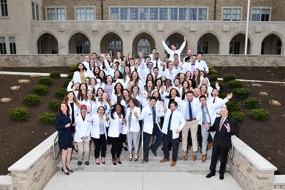 Members of the Wegmans School of Pharmacy have a little fun while taking a group photo.