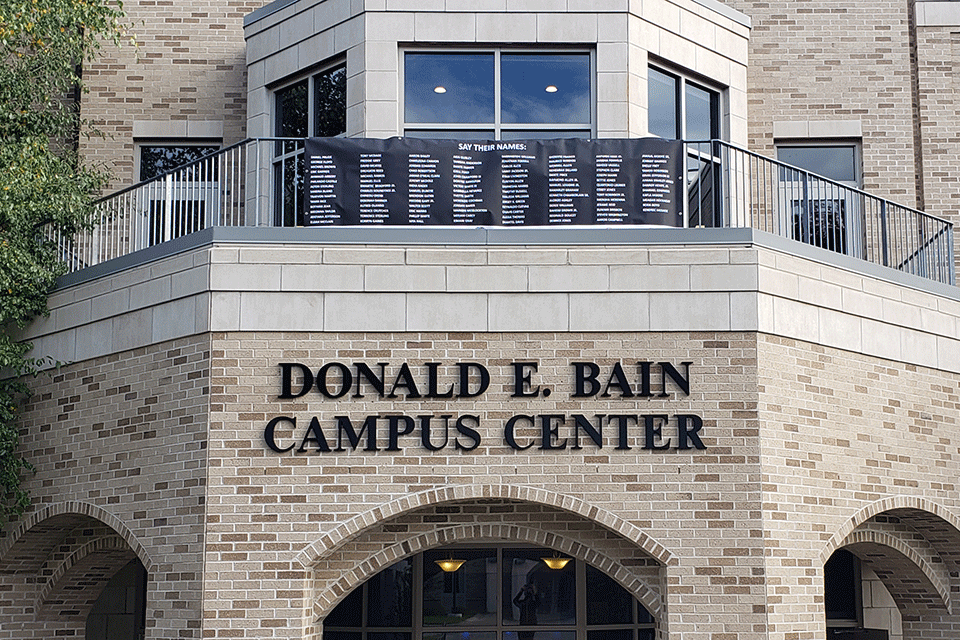 A banner lists Black lives taken unjustly. Say Their Names is the theme of an upcoming series of discussions for the campus community.