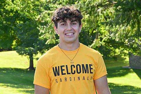 Caleb Thomas smiles during Move-In Day as a member of the Orientation Team.