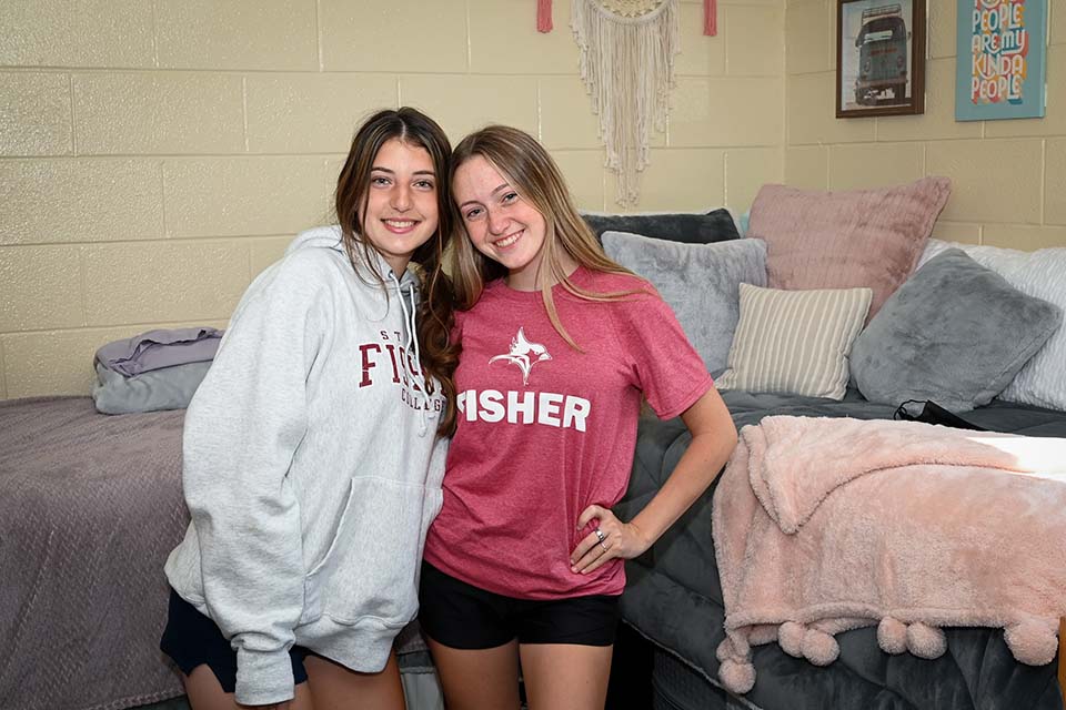 Murphy Hall roommates Abbie Irons and Rily Grimm pose in their room on their move-in day.