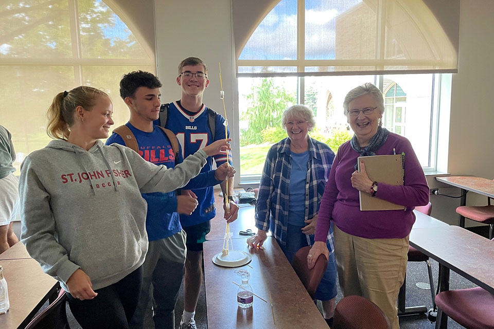 Students in Dr. Chichester's class do an activity with seniors.