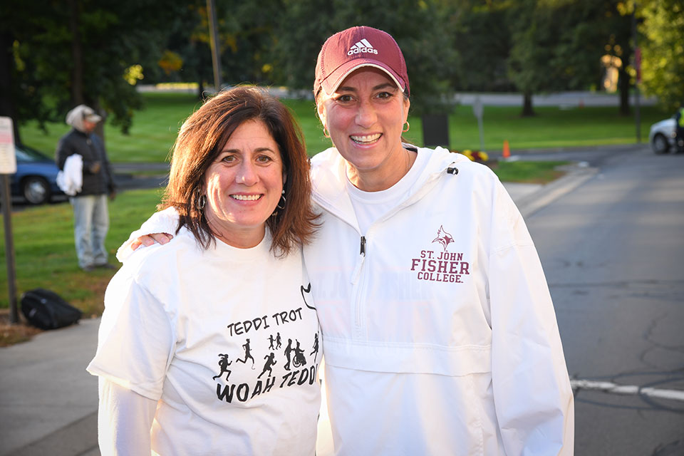 Two members of the Fisher community get ready to run in the annual Teddi Trot.