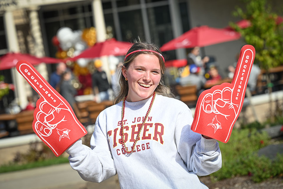 Fisher students show off their Cardinal pride during Alumni Weekend.