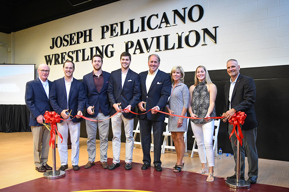 President Rooney and Jose Perales join the Pellican Family in cutting the ribbon on the newly opened Joseph Pellicano Wrestling Pavilion.