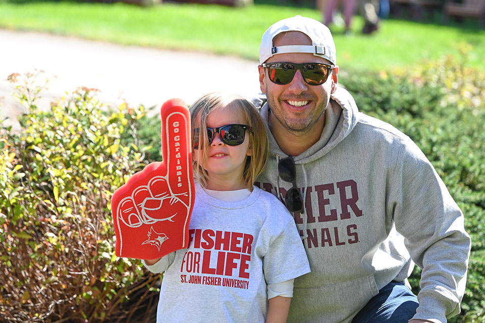 Alumni and family get ready to cheer on the Cardinals during Alumni Weekend.