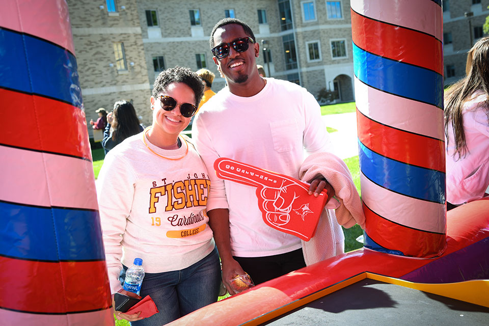 Alumni get ready to cheer on the Cardinals during Alumni Weekend.