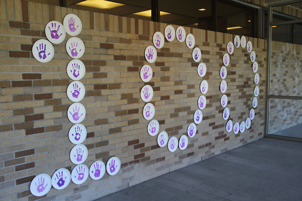 A sign promotes 100 Days Until the Teddi Dance for Love.
