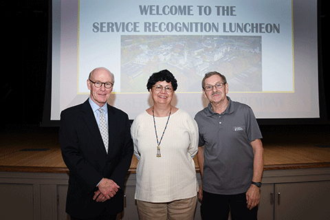 30-year honorees Sharon Delmendo and Edmund Kaszuba with President Rooney