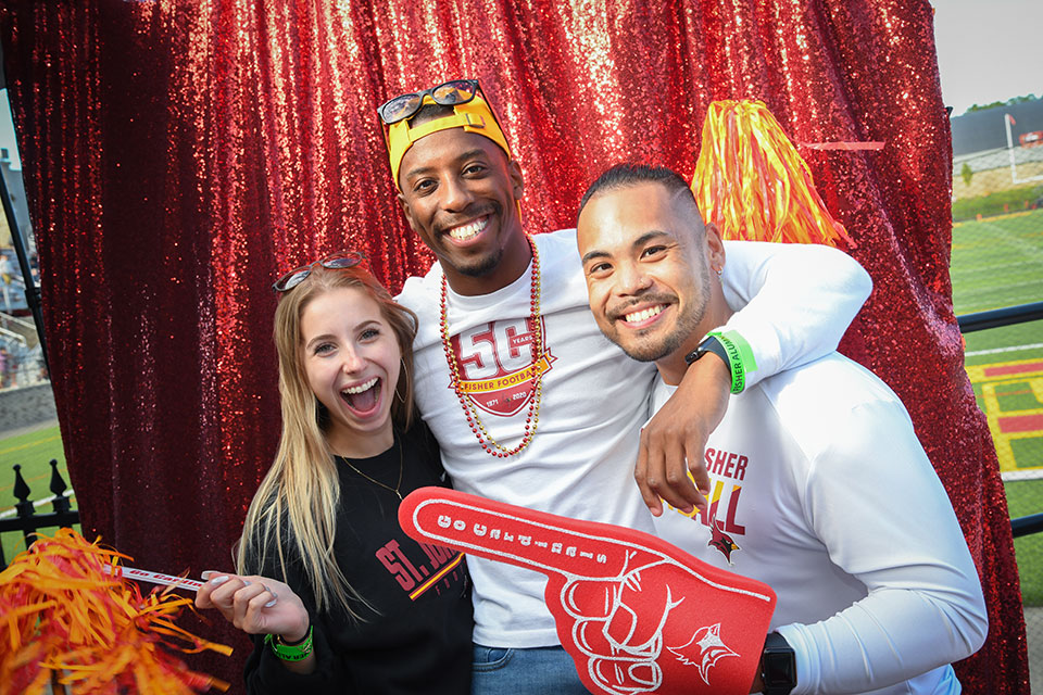 Graduates have fun in the Alumni Weekend 2022 Photo Booth.