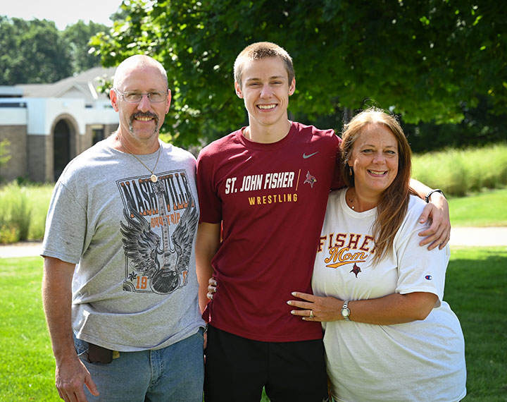 Dylan Specht (center) with his parents on Move-In Day.