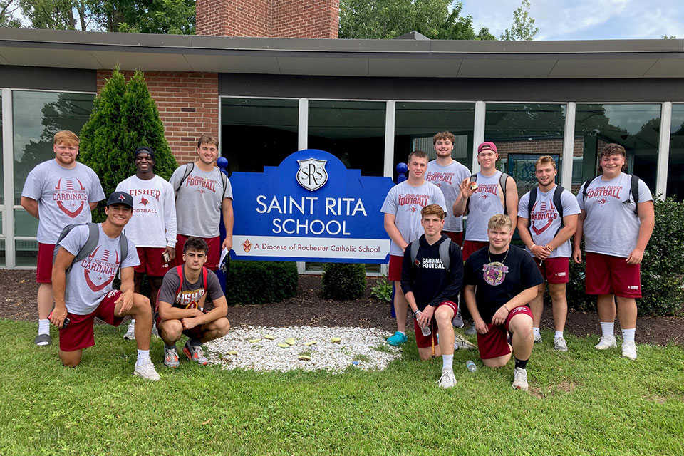 Members of the Fisher Football team at St. Rita's.