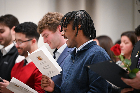 Students read the Nightingale Pledge during the nursing pinning ceremony.