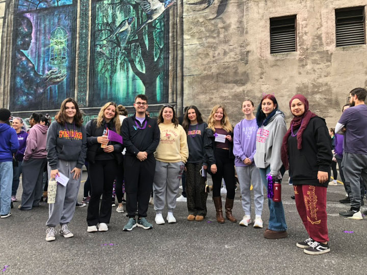 Students in the criminal justice course, Victimology, at a community event.