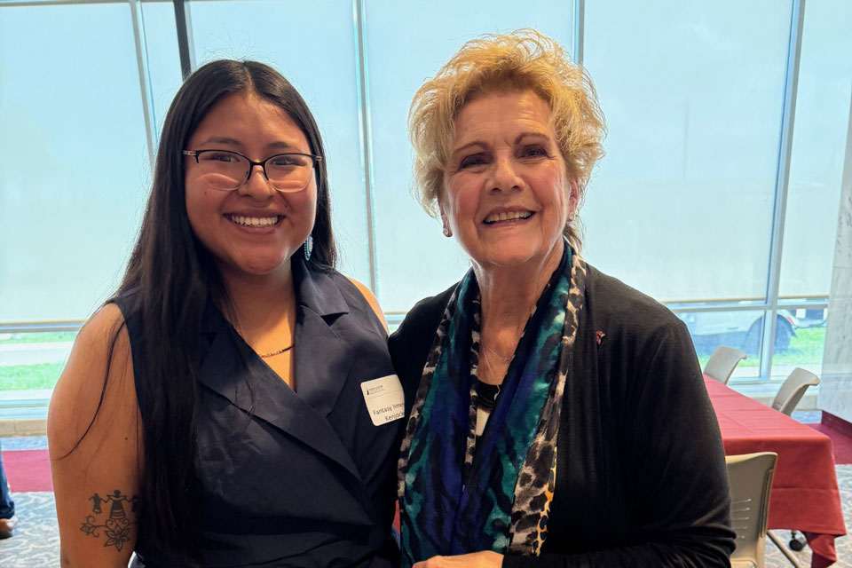 A Fisher student poses with Lucy Malmberg.