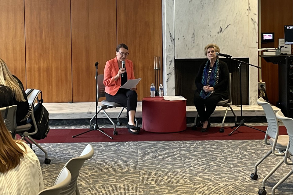Dean Christine Birnie moderates a discussion with Lucy Malmberg.