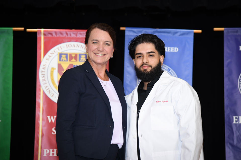 Dean Christine Birnie with a first-year pharmacy student.