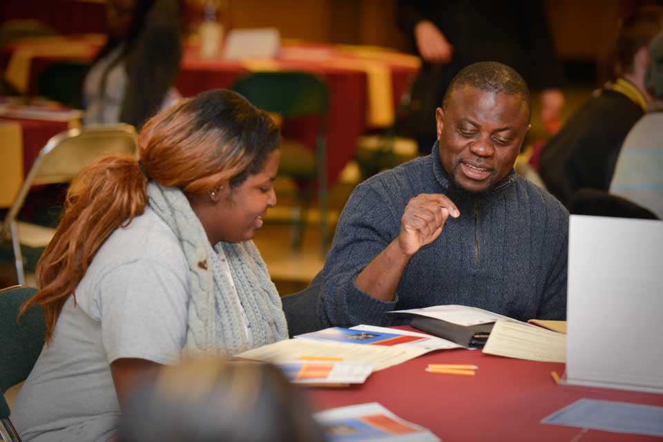 Attendees engage in conversation about spirituality and faith during the 2016 Coexistence Dinner.
