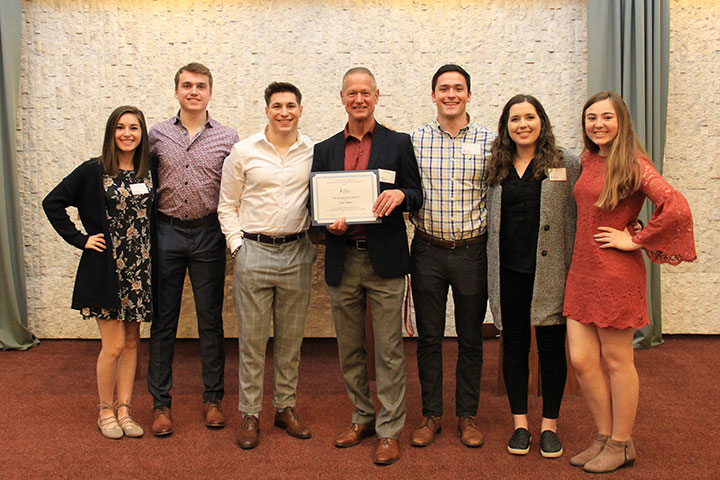 Ron Sicker (center) with students from his promotion management course.