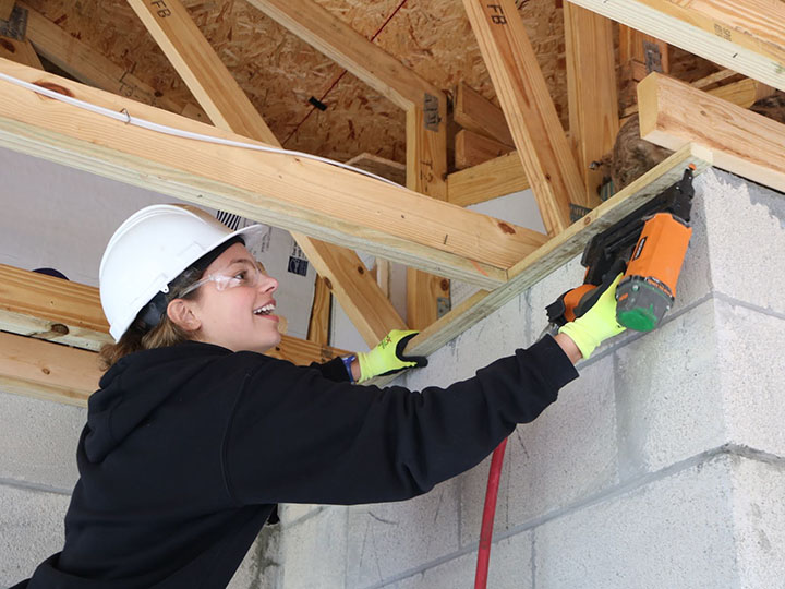 A Fisher student helps build a house through Habitat for Humanity in Tampa, Florida.