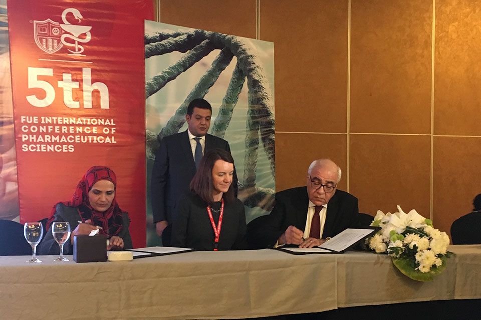 Dr. Christine Birnie signs an MOU with officials from Future University.