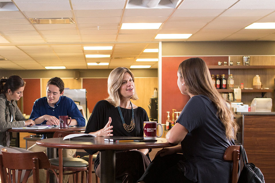 A faculty member and a student have a conversation.