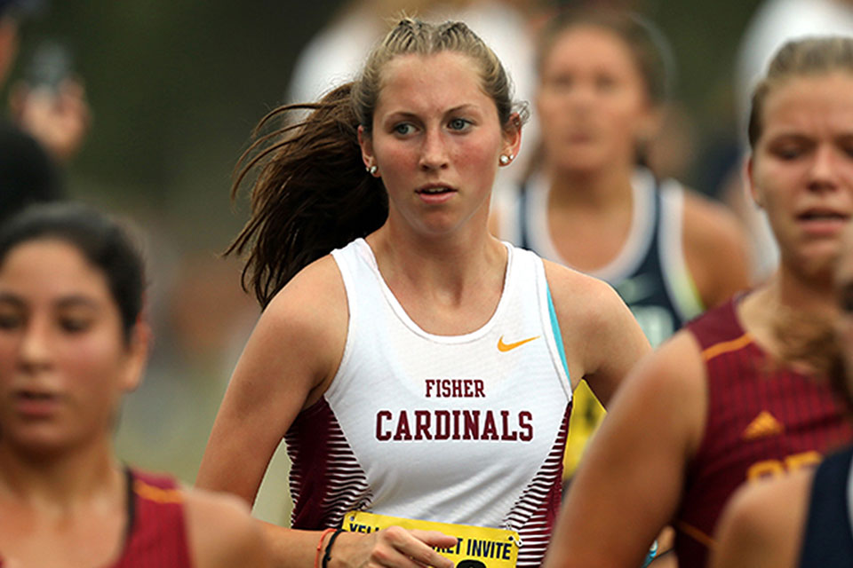 Gabriella Dunkelberg runs in a cross country race.