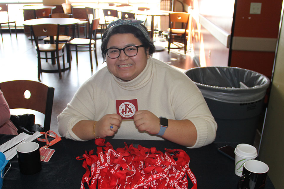 A member of RHA mans a table during the Spring Involvement Fest.