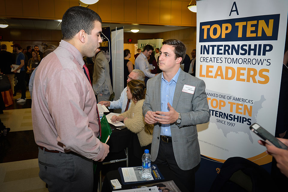 A student talks with a recruiter at the annual Career Fair.