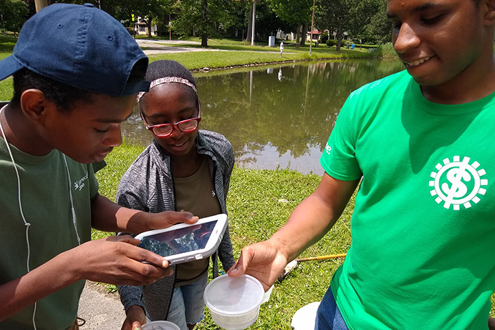 Students learn about water ecology through immersive activities.