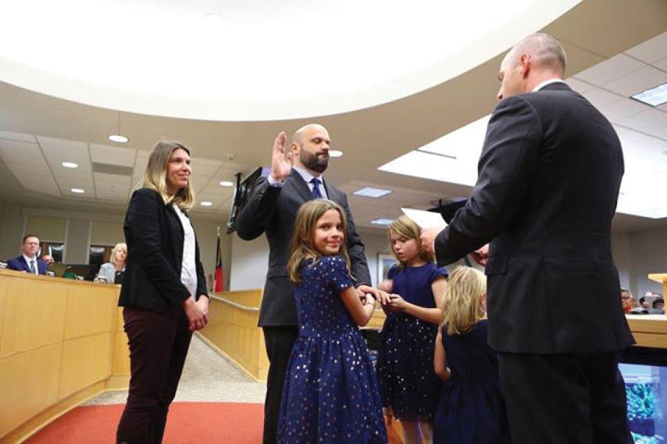 Lindsay Mahaffey watches as her husband is sworn in by Greg Ford