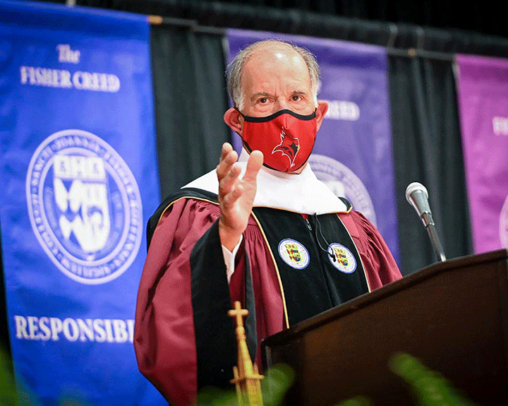 During the School of Business ceremony, alumnus Jack DePeters offers words of advice to graduates.