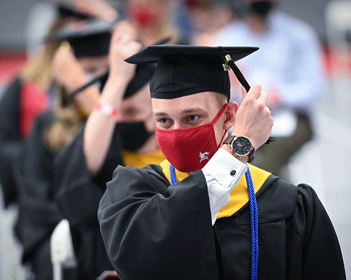 A graduate of the Ralph C. Wilson, Jr. School of Education turns his tassel.