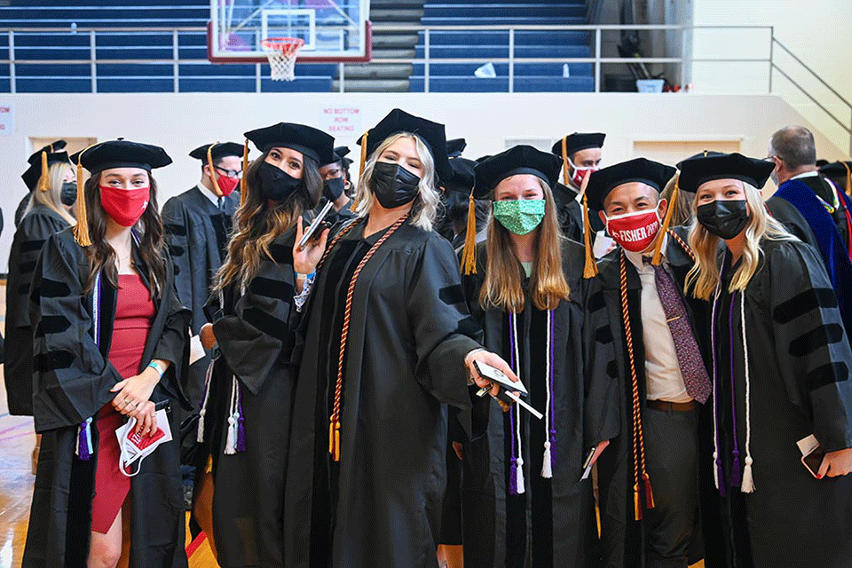 Graduates of the Wegmans School of Pharmacy anticipate the start of their Commencement ceremony.